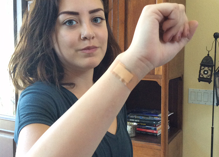 Bella La Rosa covers her self induced Libra sign before returning home.