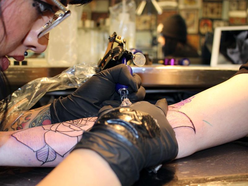 Sanchez working on her client’s outline for a cover up tattoo. (Ashley Hern)