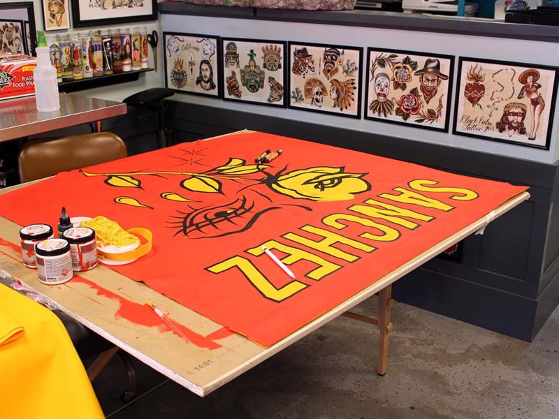 A banner Sanchez paints for the Portland Tattoo Expo. (Ashley Hern)
