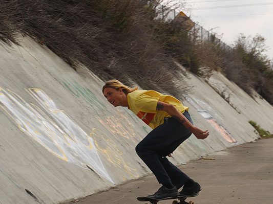 Cruising in close to the sewer wall, planning out his next trick.