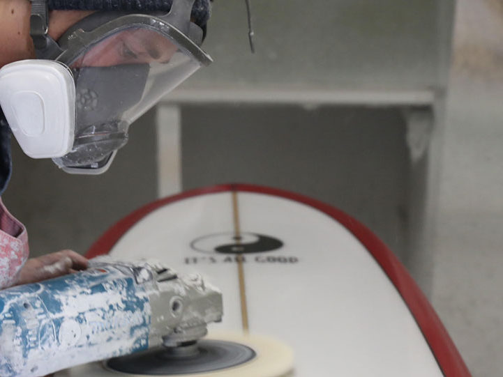 Blake Hansen buffs out a board at the shop in Oceanside, California. (Timmy Heffernan)