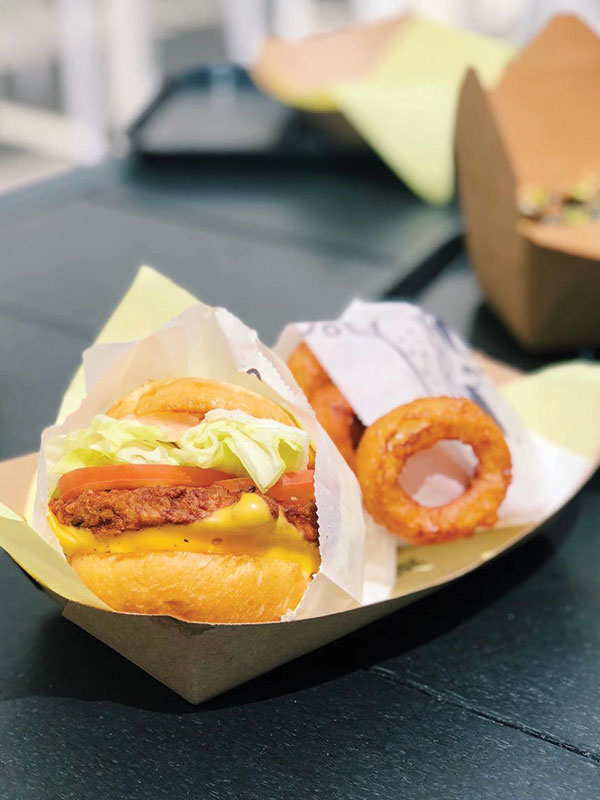 Whether your craving a burger, chicken sandwich or pulled pork on a roll, you can find it at the Trade Food Hall in Irvine. (Kristin Torres)